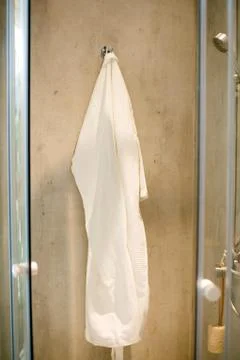 Robe on the rack in the bathroom Stock Photos