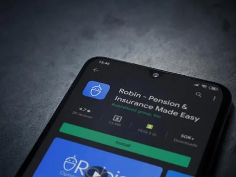 Robin app play store page on the display of a black mobile smartphone on dark Stock Photos