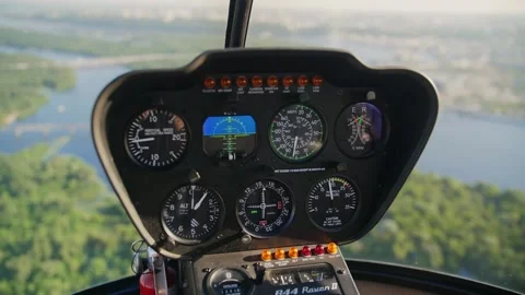 Robinson R44 helicopter control panel.Helicopter flying over the city of Kiev Stock Footage 200808408
