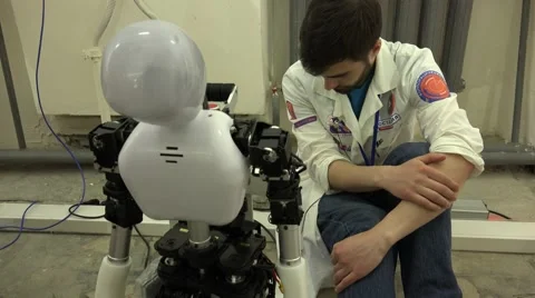Robot. AI. The robot and its creator. New technologies. Stock-Footage 50173917