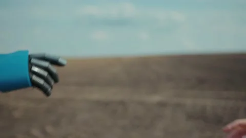 Robot and human pulling hands to reach out each other. Almost reaching robotic Stock Footage 132839966