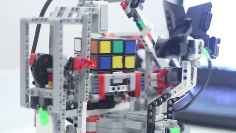 Robot and the Rubiks Cube Stock Footage 81787602
