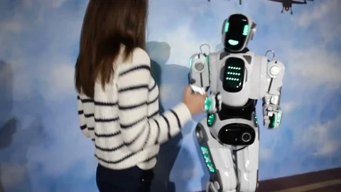Robot android dance with beutiful young woman Stock Footage 71936429
