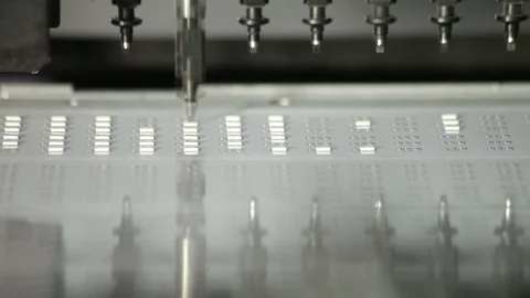 Robot applies a large number of LEDs on metal plate in production of lamps Stock Footage 100793715