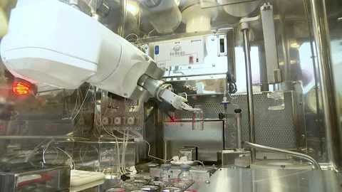 Robot arm with container or test tube in laboratory. Editorial. Stock Footage 148148601