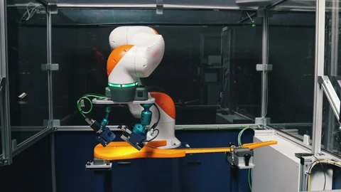 Robot arm controlling the guitar paint, modern technologies Stock Footage 274765042