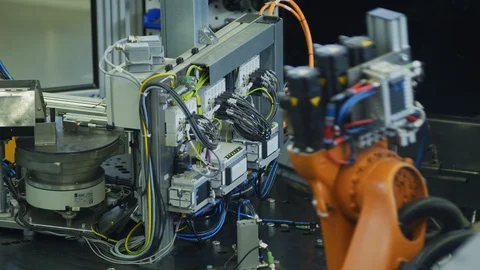 Robot Arm in High Tech Production Plant - Computerized Manufacturing Stock Footage 98710448