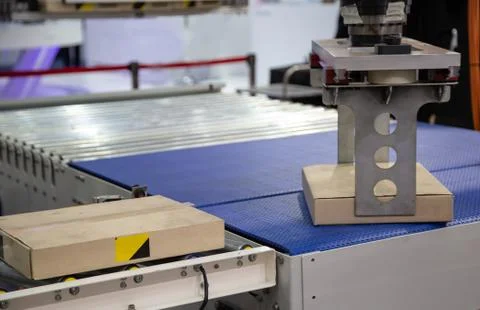 Robot arm loading in factory Stock Photos