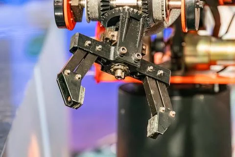 Robot arm, metallic structure, overhead light, sharp shadows multiple joints, Stock Photos