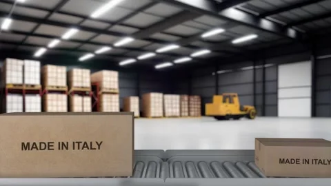 The Robot arm picks up the cardboard box Made in ITALY. Cardboard boxes with Stock Footage 256672196