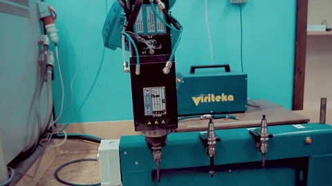 Robot arm replaces the drill bit Stock Footage 247368912