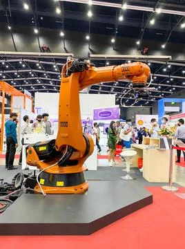 Robot arm for scan part working show it to customers in Metalex Stock Photos