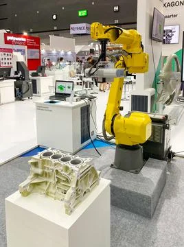 Robot arm for scan part working show it to customers in Metalex Stock Photos