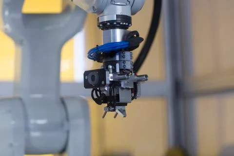 Robot arm in a sensor technology plant Stock Photos