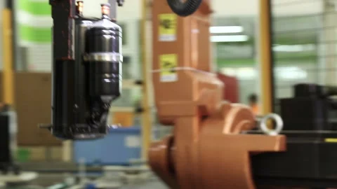 Robot arm sets the compressor to the desired location Stock Footage 162905971