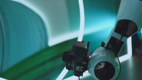 A robot arm shoots with a camera Stock Footage 310892710