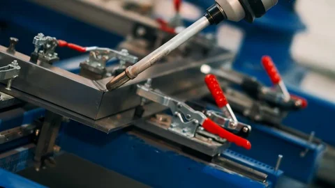 Robot Arm Welding Process at Workshop. High Precision Modern Tool in Heavy Stock Footage 130064145