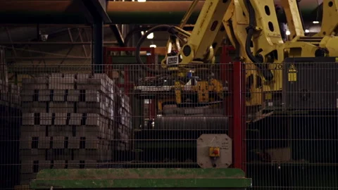 Robot Arms Lift Bricks From Stack And Place Them On Production Line Stock Footage 155447676