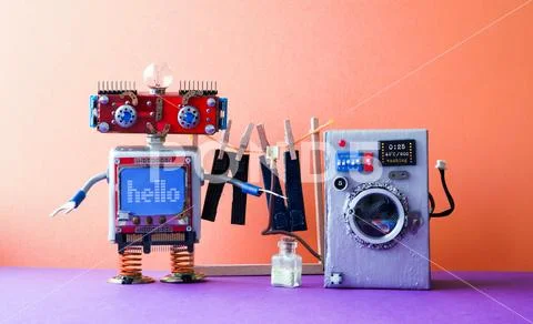Robot automation laundry room. Robotic washer with message Hello. Silver washing Stock Photos