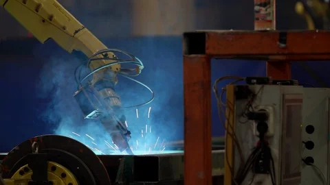 The robot brews an iron part of the technique Stock Footage 128353304