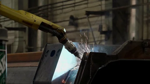The robot brews an iron part of the technique Stock Footage 128353578