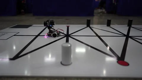 Robot car running on board for competition Stock Footage 140032992