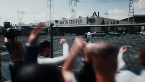 Robot carrying weapon,angry crowd protesting AI. data center, anti-AI concept. Stock Footage 336345932