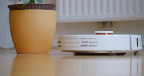 Robot cleaner cleans the room. Stock Footage 124182571