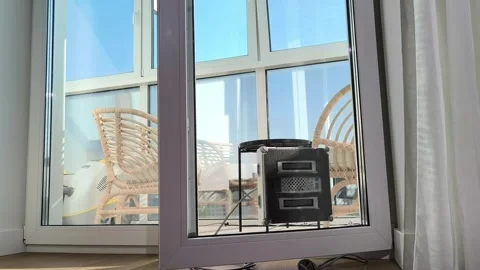 Robot cleaner operates on window glass covering edges and central area. Sma.. Stock Footage 343261295