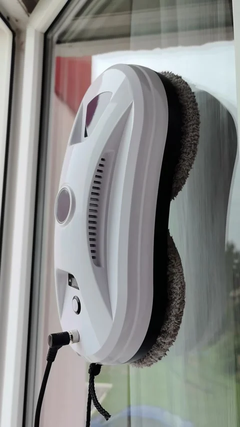 A robot cleaner of windows and walls, modern equipment for cleaning the house. Stock Footage 317766261