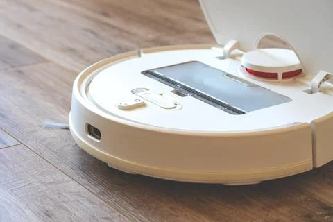 Robot cleaner.Garbage container Stock Photos