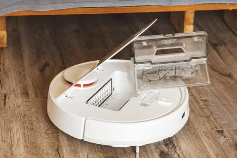 Robot cleaner.Garbage container Stock Photos