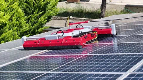 Robot cleans solar panels - 4k drone footage of robot cleaning solar panels Stock Footage 310228416