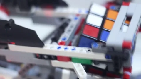 Robot with a color sensor collects Rubiks Cube Stock Footage 81787360