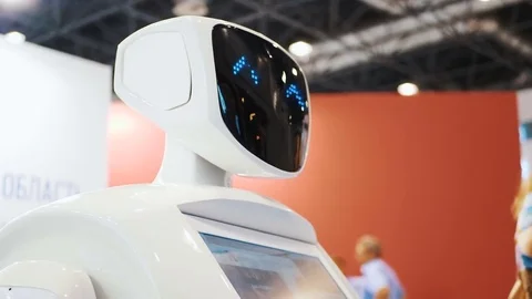 A robot to communicate with people. Artificial Intelligence. The robot turns its Stock Footage 81747176