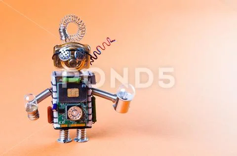 Robot concept retro style. Circuits socket chip toy mechanism, funny head, eyes Stock Photos