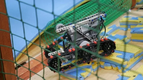 Robot crawler drive to overcome obstacles on the competition Stock Footage 85717036