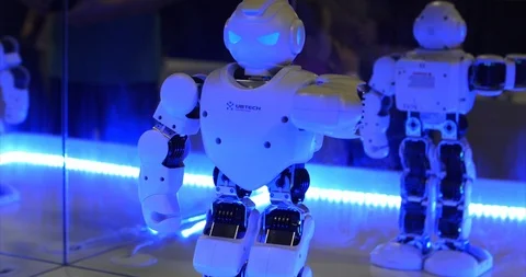 Robot dancing. Robotic Modern Technology. The robot looks into the camera at the Stock Footage 98267365