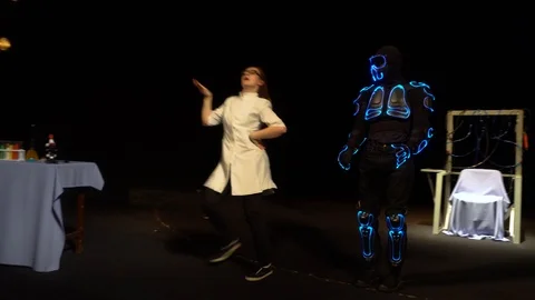 The robot is dancing with a scientist Stock Footage 98211054
