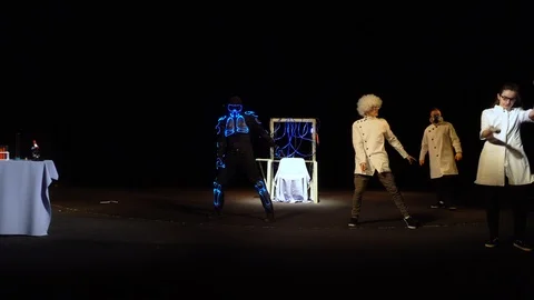 The robot is dancing with a scientist Stock Footage 98211082