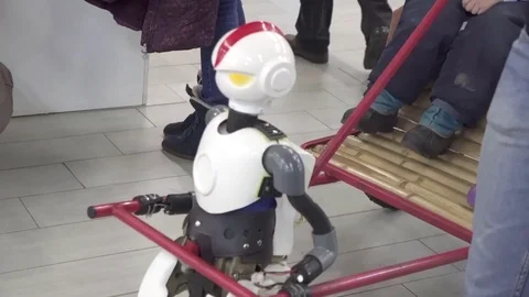 Robot drags people Stock Footage 83432249