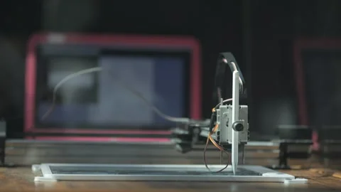 The robot draws on a tablet. Stock Footage 313462689