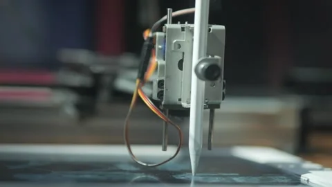 The robot draws on a tablet. Stock Footage 313647430