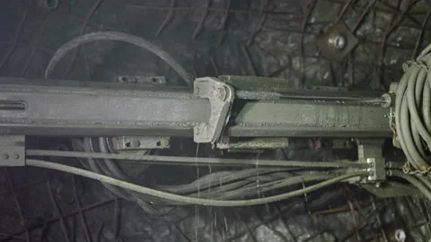 Robot drill with pipes and coolant operates in ore mine Stock Footage 236742766