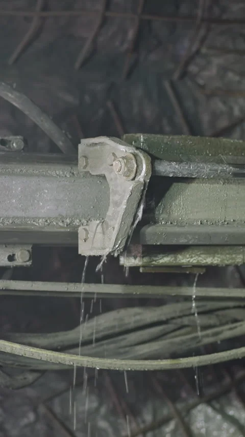 Robot drill with pipes and coolant operates in ore mine Stock Footage 309050247