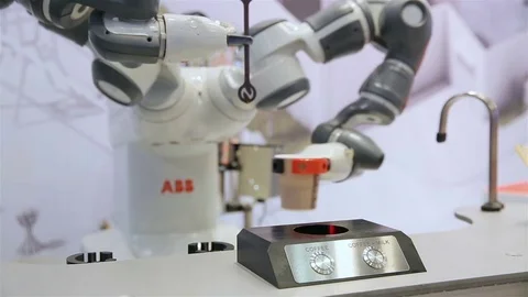 Robot with flexible hands makes a coffee. Stock Footage 81005607