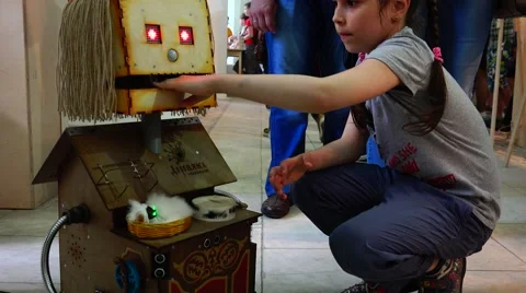 Robot grinder communicates with children. New technologies. Stock Footage 52361470