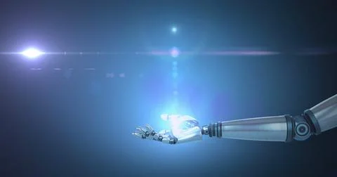 Robot hand extending towards glowing light, giving a futuristic feel Stock Photos