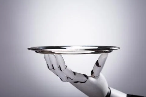 Robot Hand Holding Empty Plate Stockfoto's