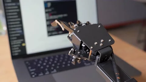 Robot Hand Moving While Using a Laptop Stock Footage 239185790